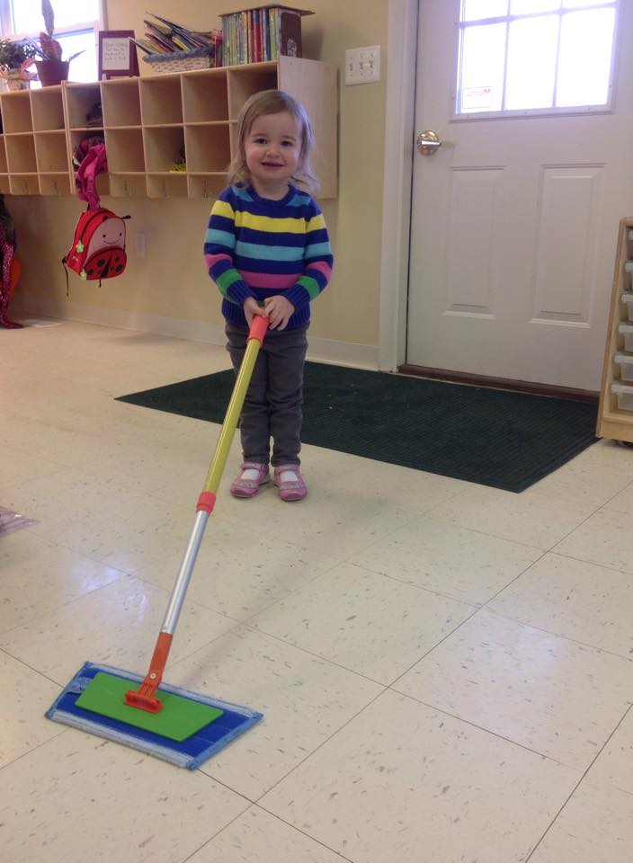 mopping the floor with our child sized mop